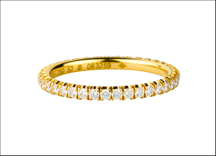 Cartier: fede in oro giallo 18 carati, ornata di diamanti taglio brillante, circa 0,5 carati, larghezza 2 mm. 