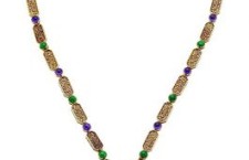 This Buddha sautoir 1971 is gold with malachite amethysts emeralds sapphires lapis lazuli rubies and diamonds.