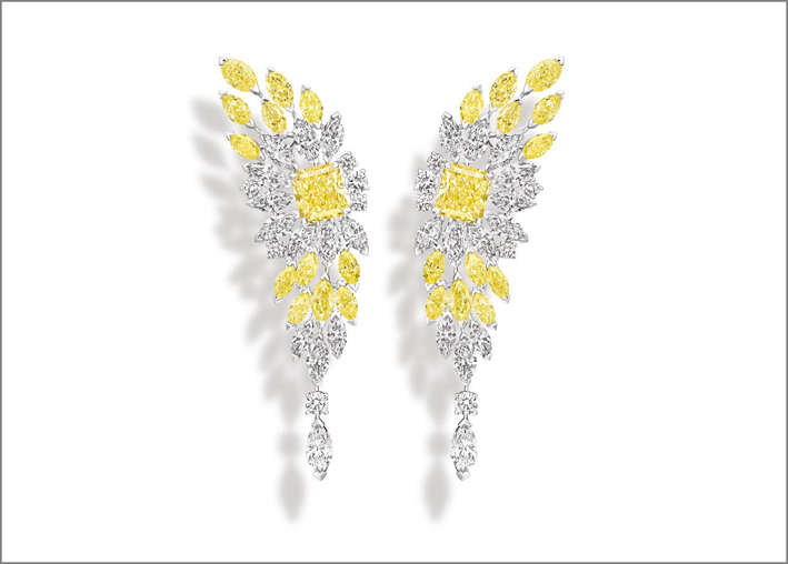 Golden Hour Earrings, yellow gold and platinum earrings set with 2 radiantcut fancy vivid yellow diamonds (approx. 3.10 cts and 3.05 cts), 24 marquise-cut yellow diamonds (approx. 5.52 cts), 26 marquise-cut diamonds (approx. 7.97 cts) and 12 brilliant-cut diamonds (approx. 1.14 cts). Unique creation