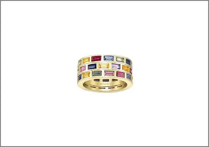 Banda in oro composta da tre anelli rotanti e gemme colorate