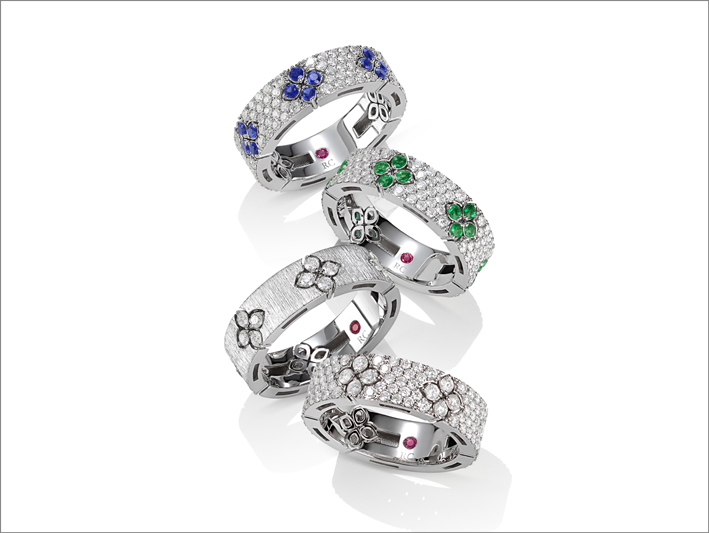 Satin finish and full pavé rings in white gold with blue sapphires, emeralds and diamonds