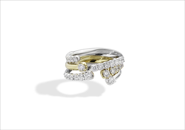 Tre anelli in oro giallo e bianco con diamanti