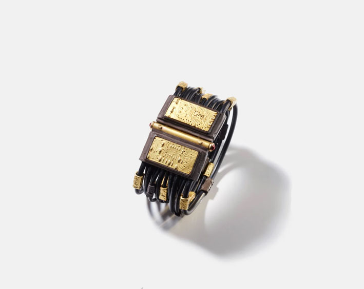 Orbit bracelet, 18kt gold, oxidised silver and rubies