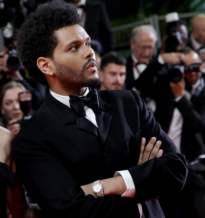The Weeknd, singer, actor, songwriter, music producer is officially making its debut at the 2023 Cannes Film Festival to present with the highly acclaimed Sam Levinson their new series The Idol produced by HBO alongside Lilly Rose Deep and Suzanna Son. The Weeknd dazzles on the red carpet wearing a Limelight Gala High jewelry Watch in white gold and yellow sapphires by Piaget